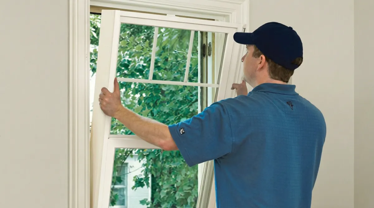 Professional contractors performing a residential window insulation and replacement service in Philadelphia, PA